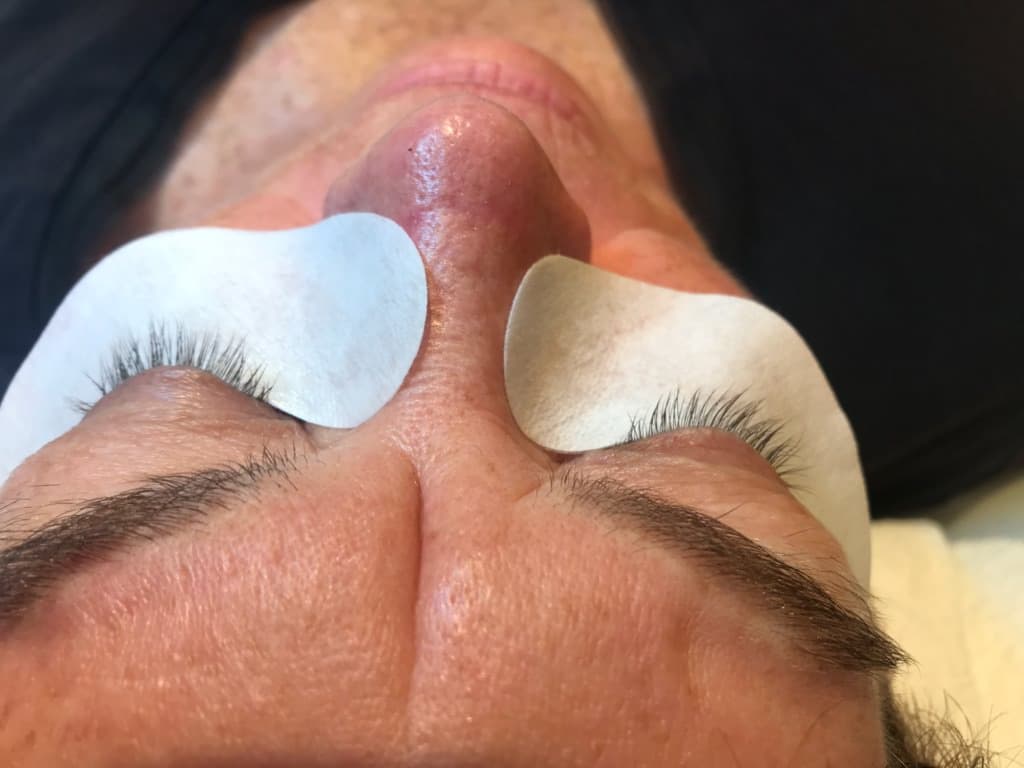 Natural lashes before extensions, under-eye pads applied