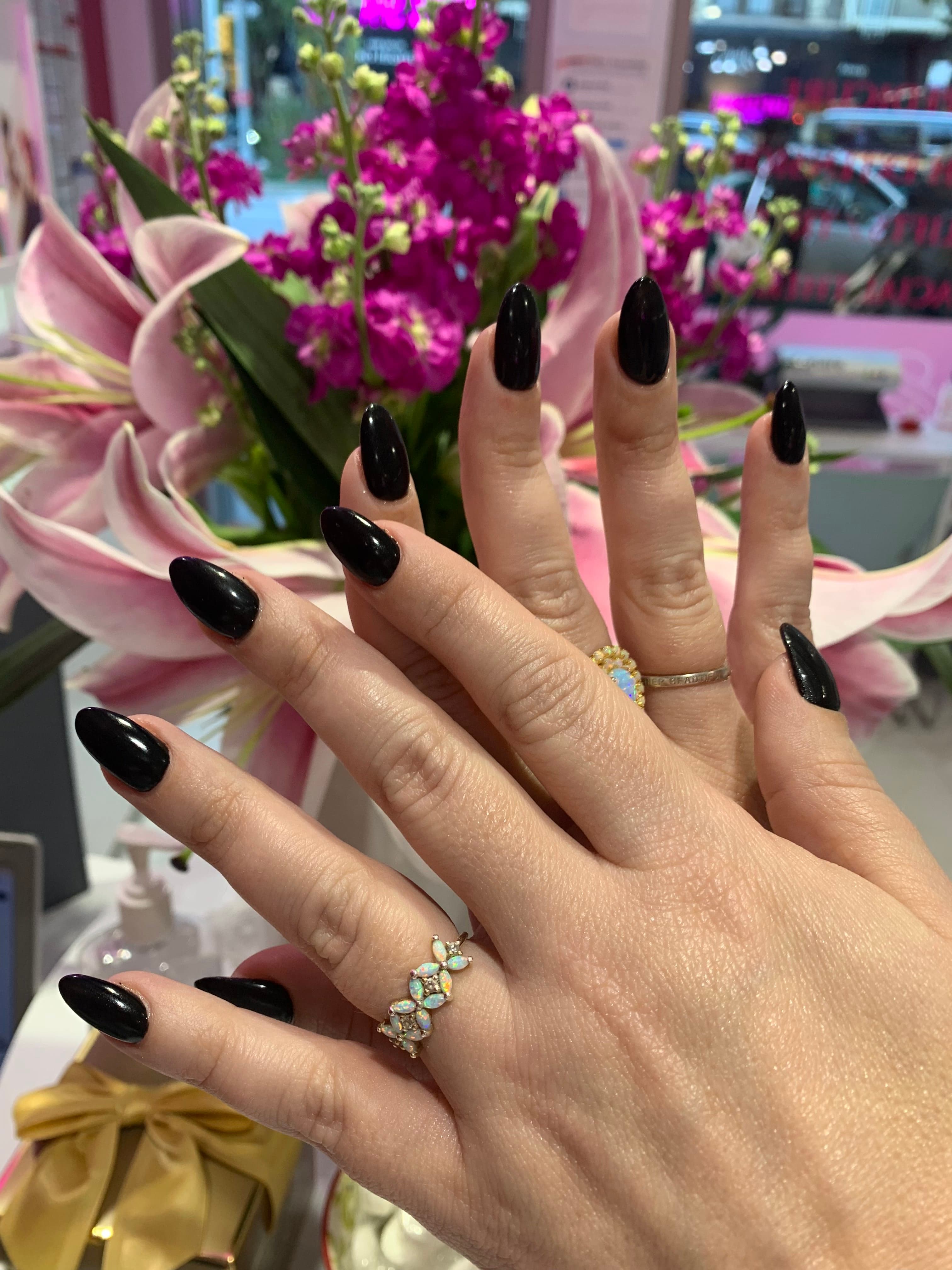 Glossy black almond nails