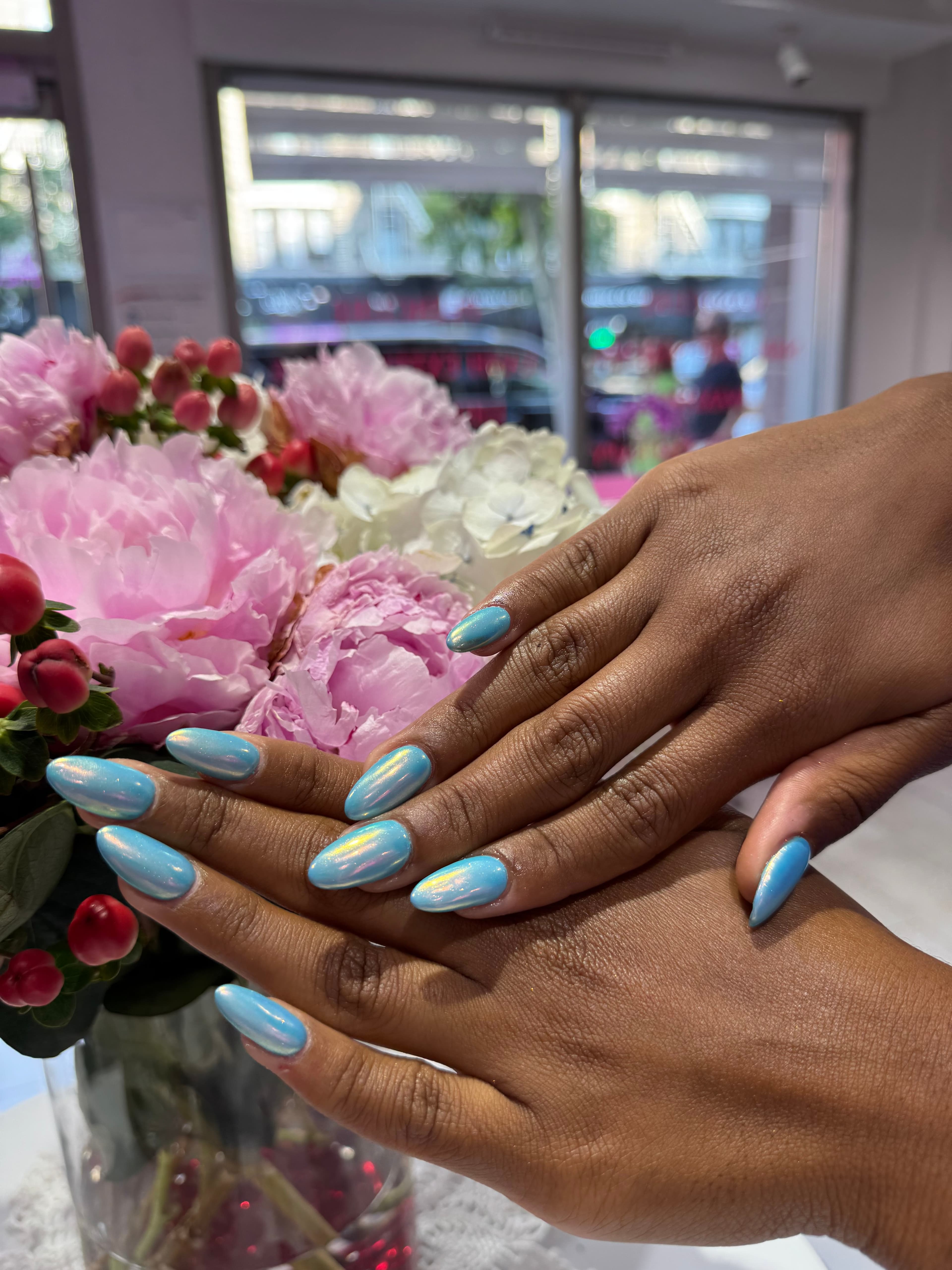 Baby-blue chrome almond nails