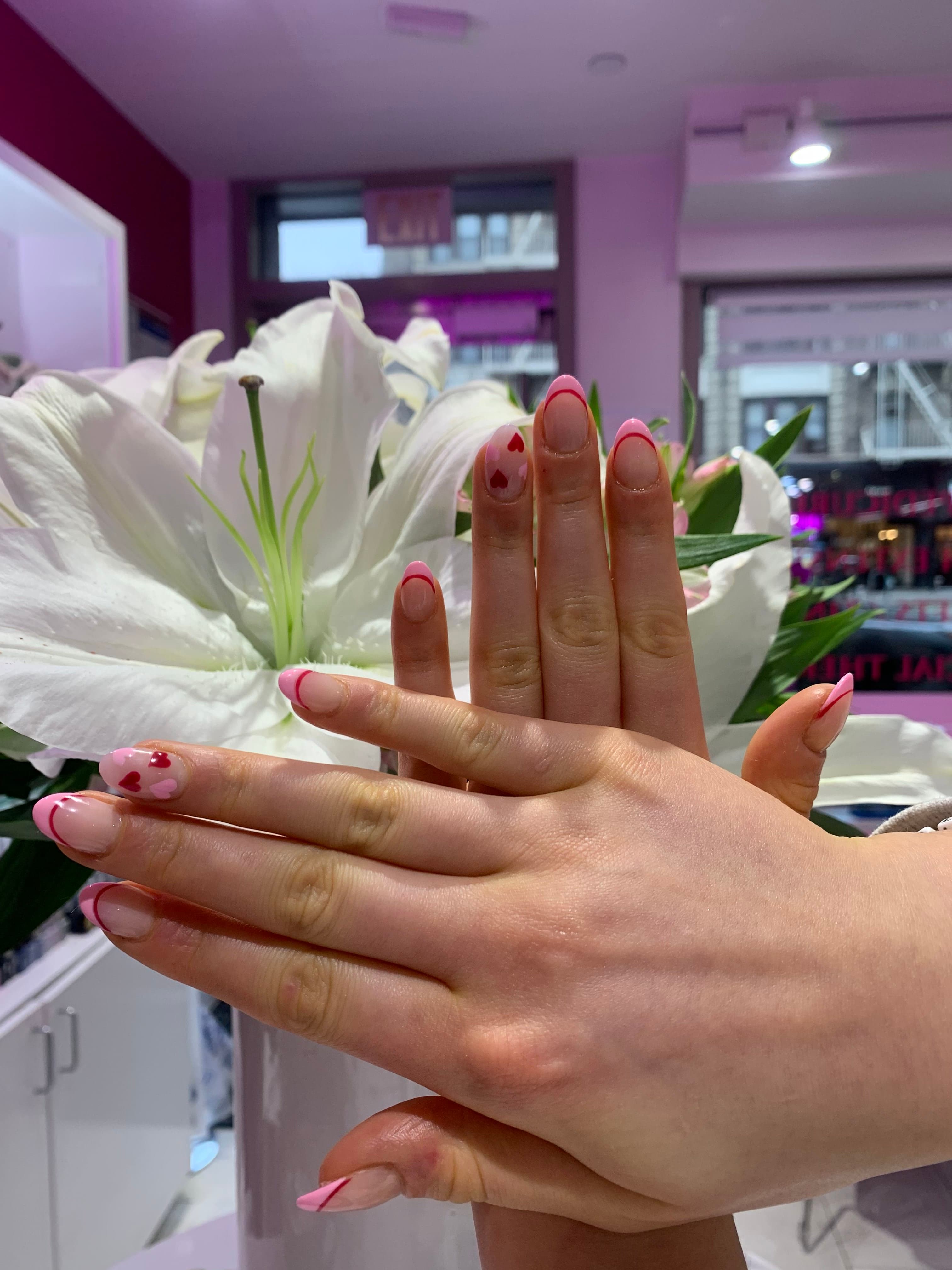 Pink and red heart French-tip nails