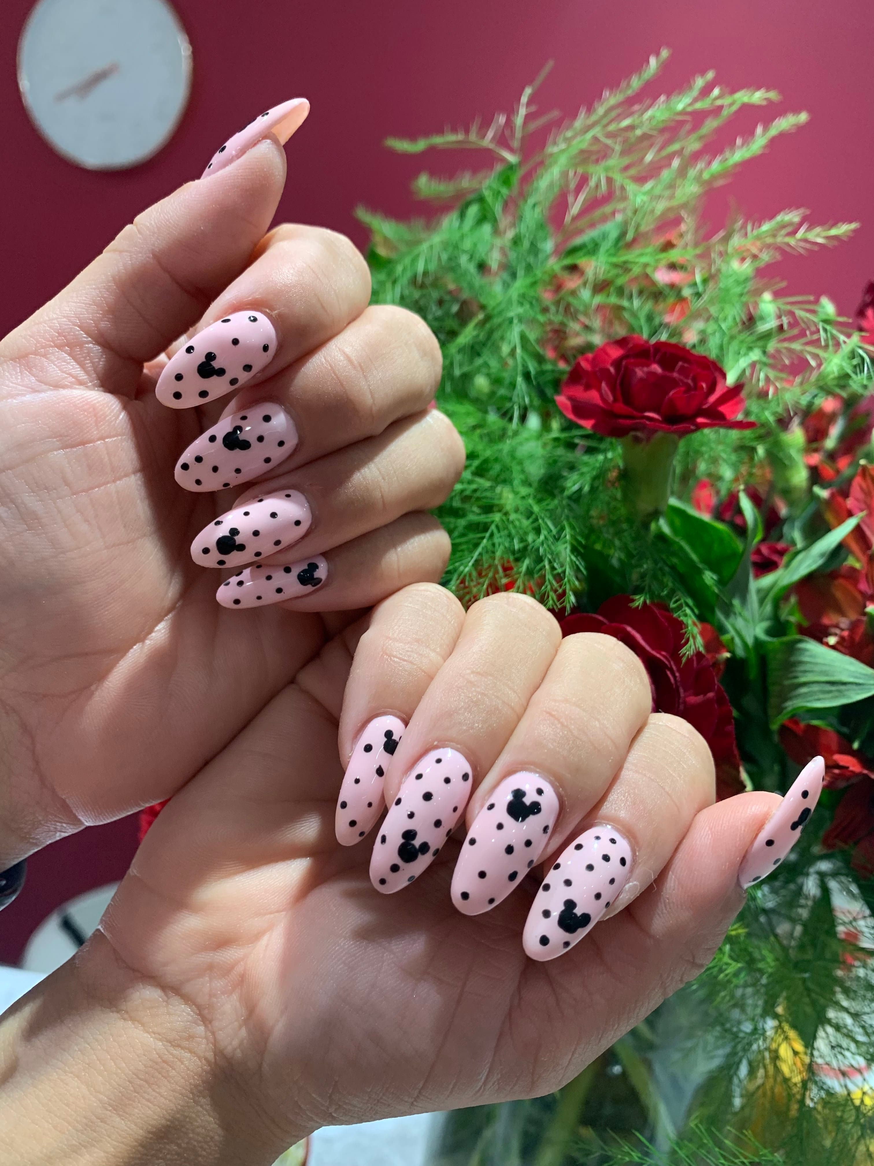 Blush nails with black polka-dot and Mickey art
