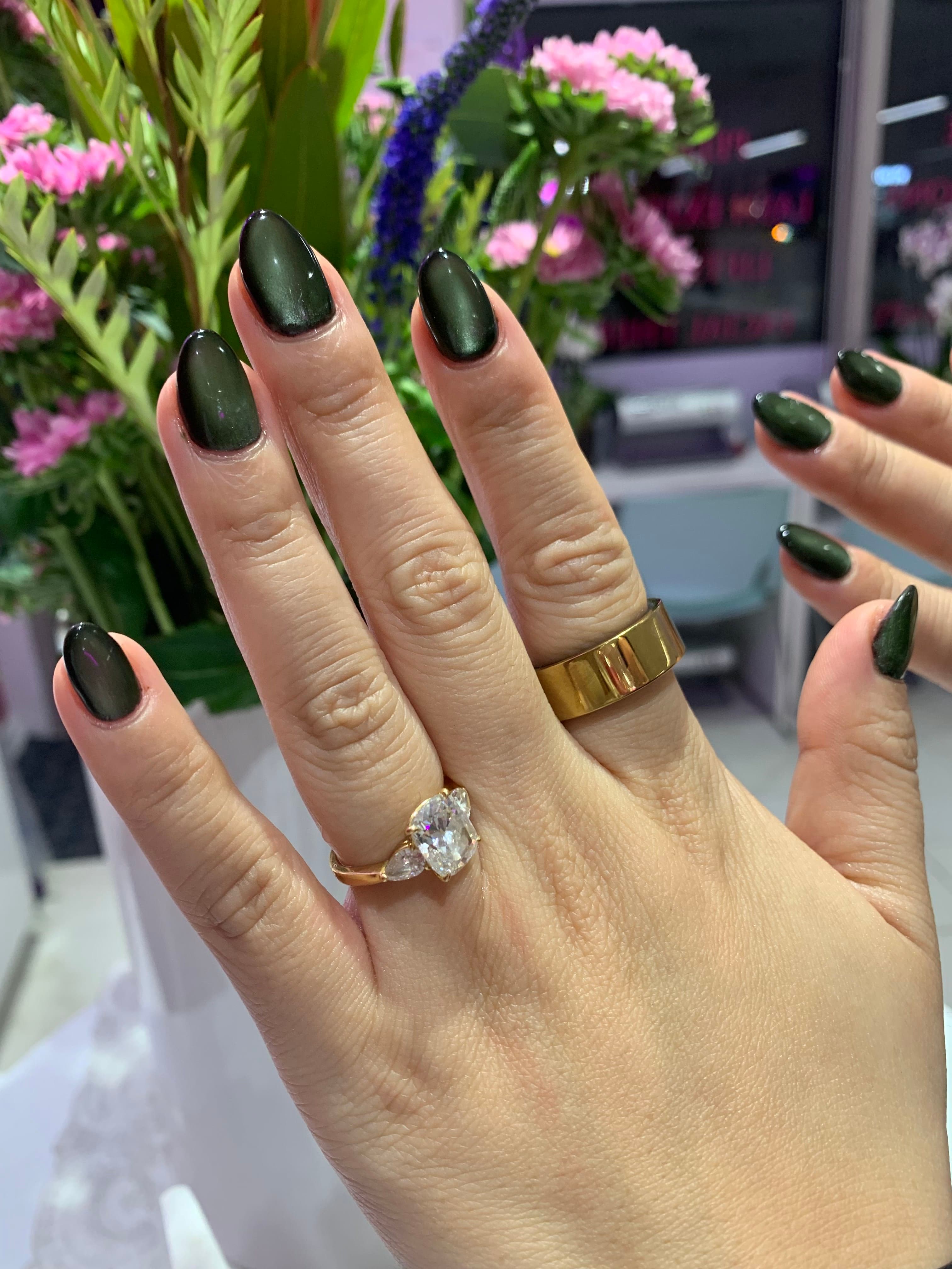 Glossy olive-green almond nails