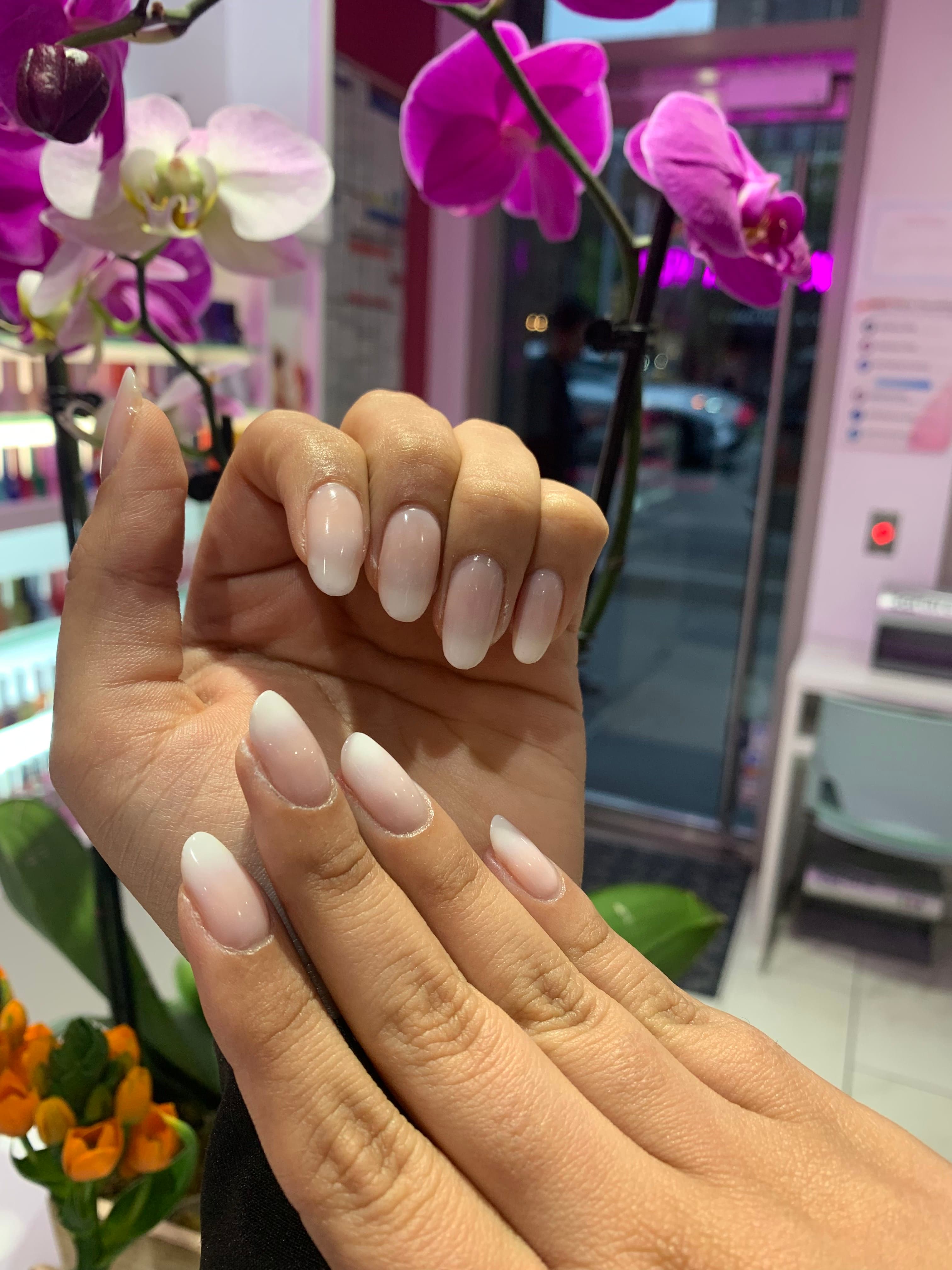 Nude-to-white ombré almond nails