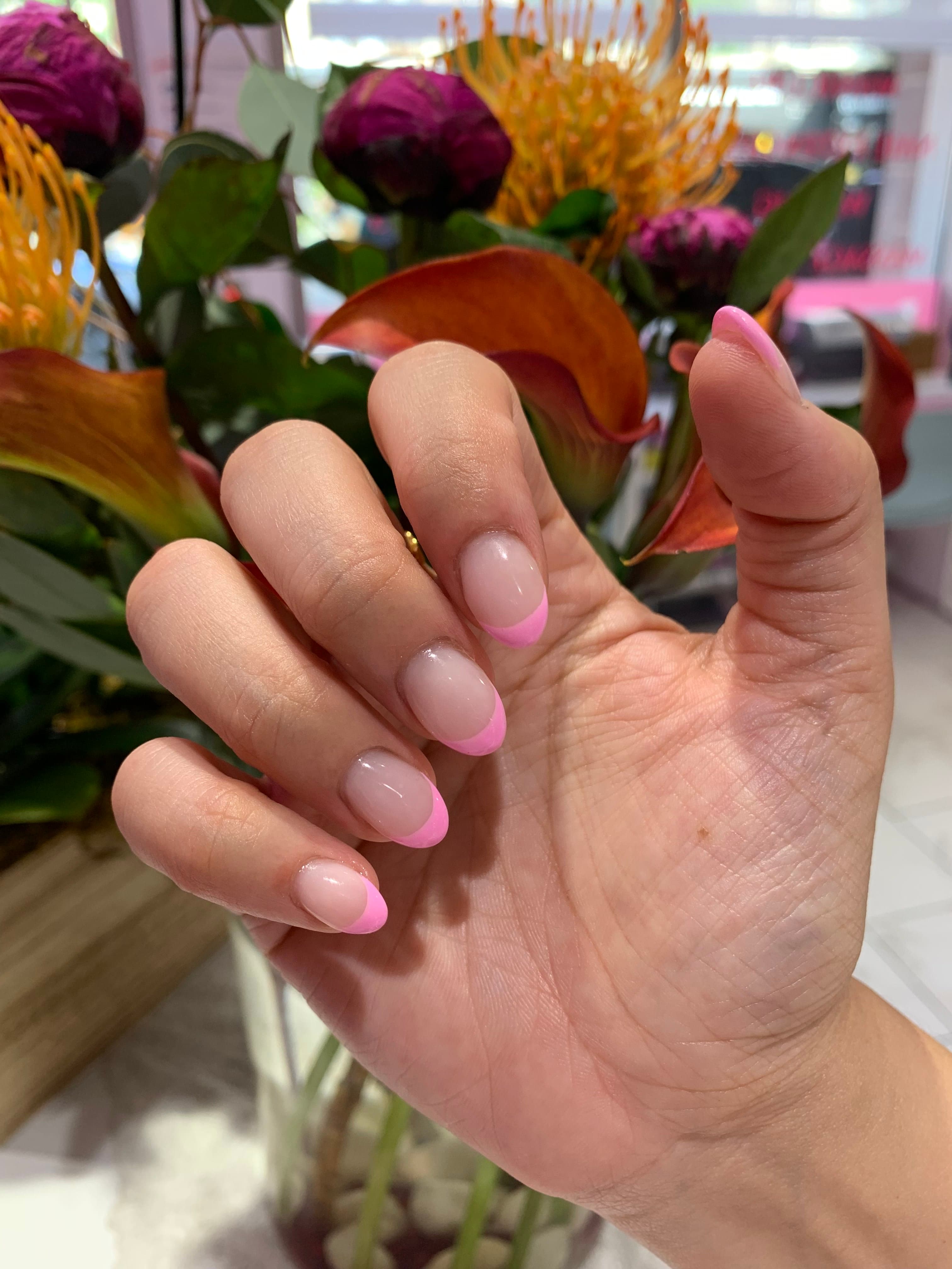 Bubblegum-pink French-tip nails
