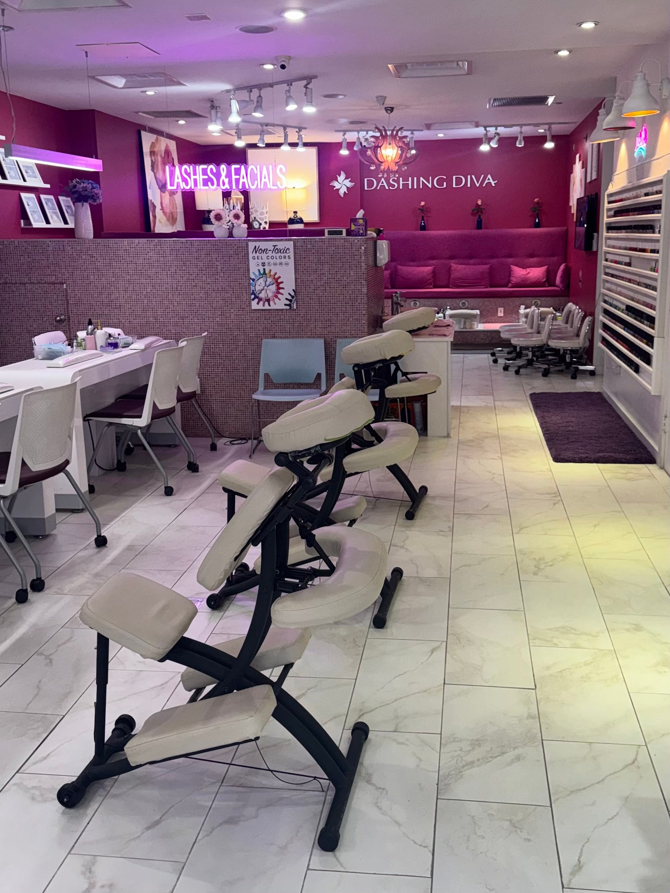 Salon interior with manicure tables and massage chairs